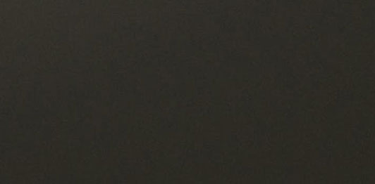ALUCOBOND Anodized Look C34 finish featuring a deep rich black tone with warm metallic undertones, ideal for elegant contemporary facades.