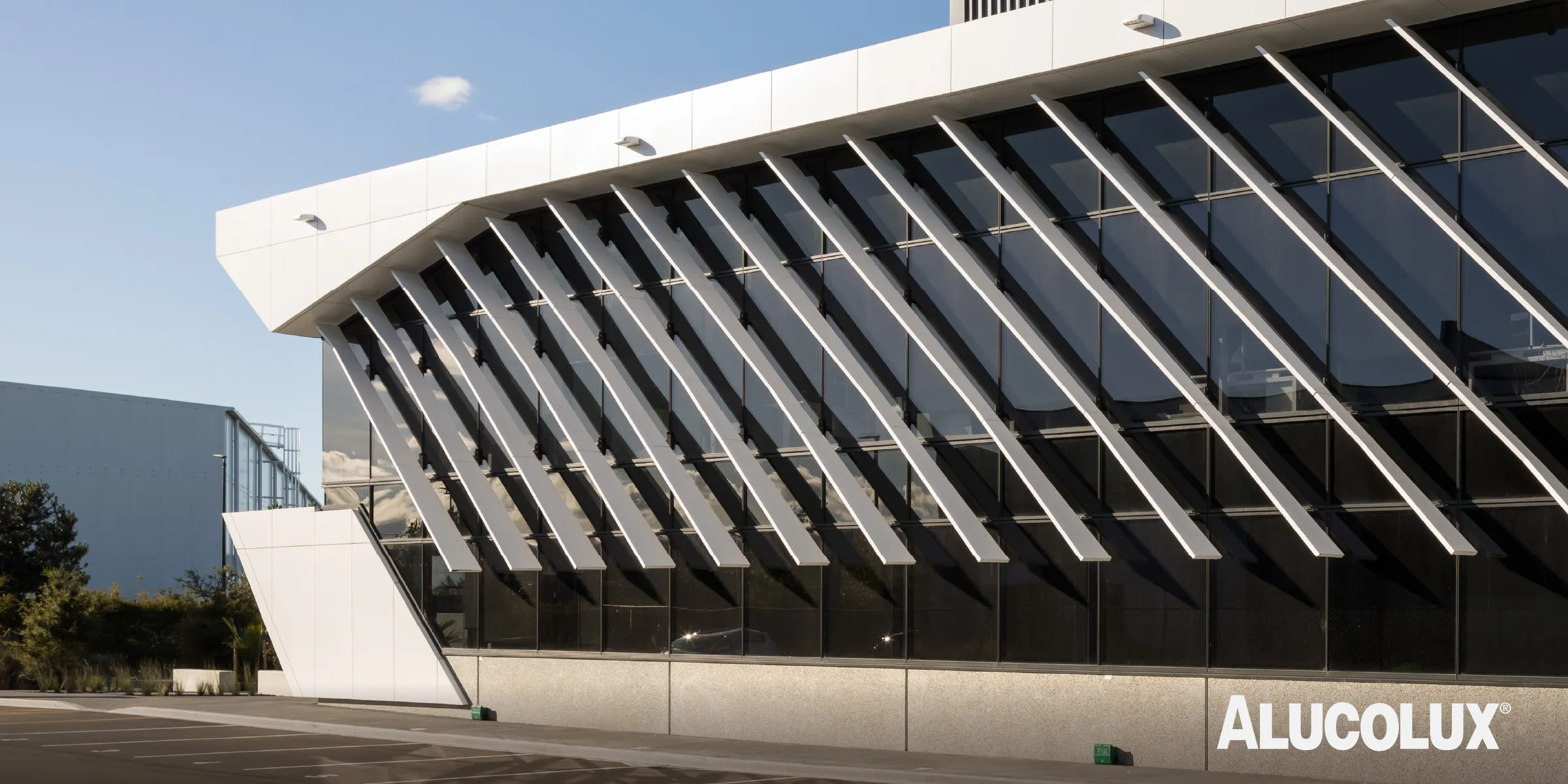 Close-up detail of Alucolux Pure White solid aluminium cladding panels installed on the Timberly Road facade by eclipse ARCHITECTURE